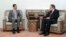Syrian President Bashar al-Assad (left) meets with Russian Deputy Foreign Minister Mikhail Bogdanov in Damascus in August 2011.