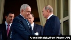 Russian President Vladimir Putin (right) and Israeli Prime Minister Benjamin Netanyahu