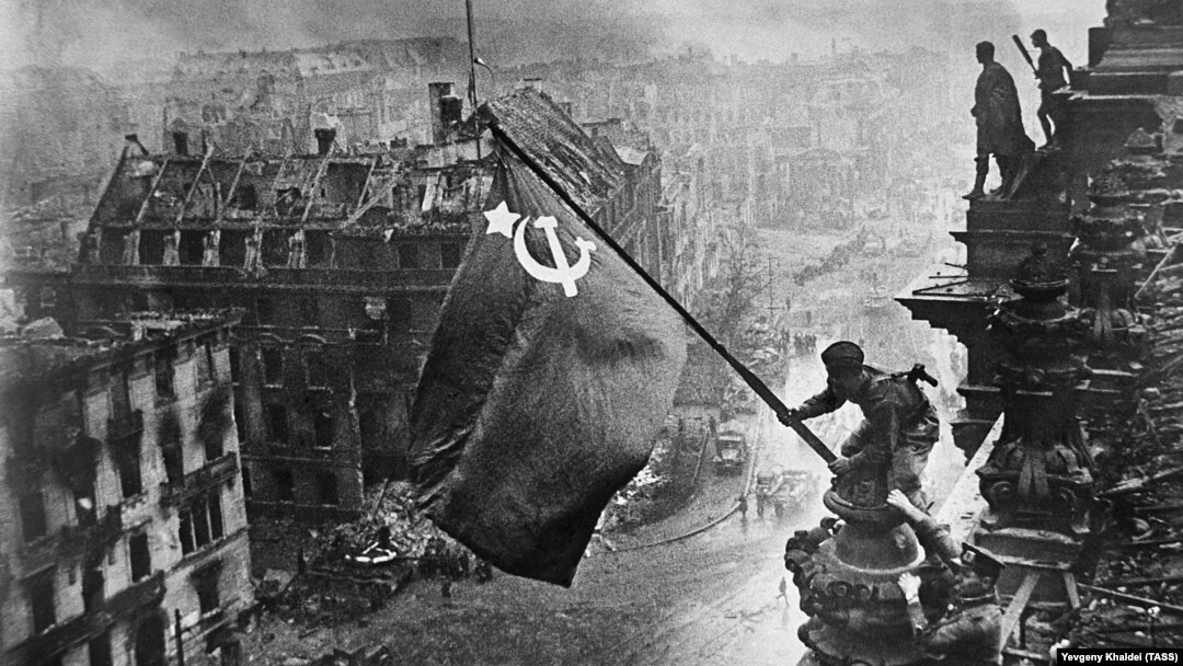 Is it 1945 all over again? Red Army soldiers hoist the Soviet flag over the Reichstag in Berlin at the end of World War II.