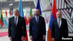 Belgium - Azerbaijan's President Ilham Aliyev, Armenian Prime Minister Nikol Pashinian and European Council President Charles Michel pose for a picture in Brussels, May 14, 2023.