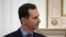 Ish-Presidenti i Sirisë, Bashar al-Assad gjatë një takimi me presidentin e Rusisë, Vladimir Putin në Moskë. Foto nga arkivi