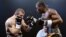 Georgian boxer Avtandil Khurtsidze (left) in a boxing match with a French opponent in 2010
