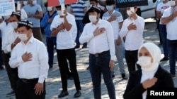 Этнические уйгуры участвуют в акции протеста против политики Китая в Синьцзяне. Стамбул, Турция, 1 октября 2020 года.