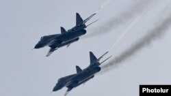 Armenia - Russian MiG-29 fighter jets fly over the Erebuni airbase, Yerevan, 12Feb2016.