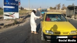 The photos show smiling militants from Nusra's Uzbek-led battalion Katiba Sayfullah Shishani handing out the "miswak sticks."