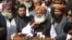 Ikramur Rehman was affiliated with the party of firebrand cleric Maulana Fazlur Rehman (center), who heads an 11-party opposition alliance to topple the government.
