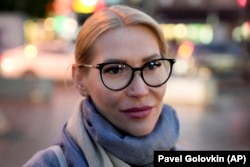 Alyona Popova, who advocates for victims of domestic violence, suspects her car was set ablaze either by political opponents or activists aligned with the ultra-right Male State movement.