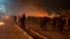 This video grab taken on January 13, 2026 from UGC images posted on social media on January 10, 2026 shows clashes in Mashhad, in northeastern Iran.
