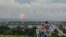 RUSSIA -- A family watches explosions at a military ammunition depot near the city of Achinsk in eastern Siberia's Krasnoyarsk region, in Achinsk, August 5, 2019