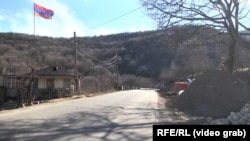 The Armenian flag flies over part of the border village of Shurnukh in the southern Syunik province (archive)