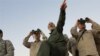 SYRIA -- Iran's army chief of staff Maj. Gen. Mohammad Bagheri (L) looks into binoculars as he visits and other senior officers from the Iranian military a front line in the northern province of Aleppo, October 20, 2017