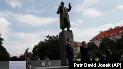 Prague 6 district representatives unveil a new explanatory text about the role of Soviet Marshal Ivan Konev at his monument in Prague on August 21, 2018.