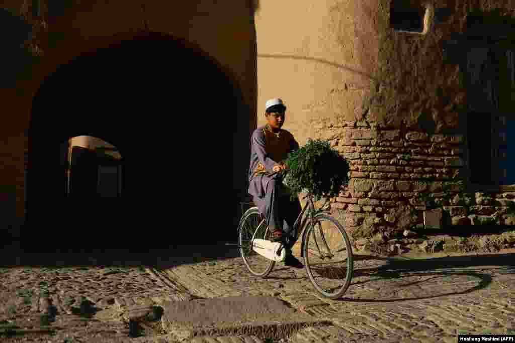 A young boy rides his bicycle in the old part of Herat, Afghanistan. (AFP/Hoshang Hashimi)