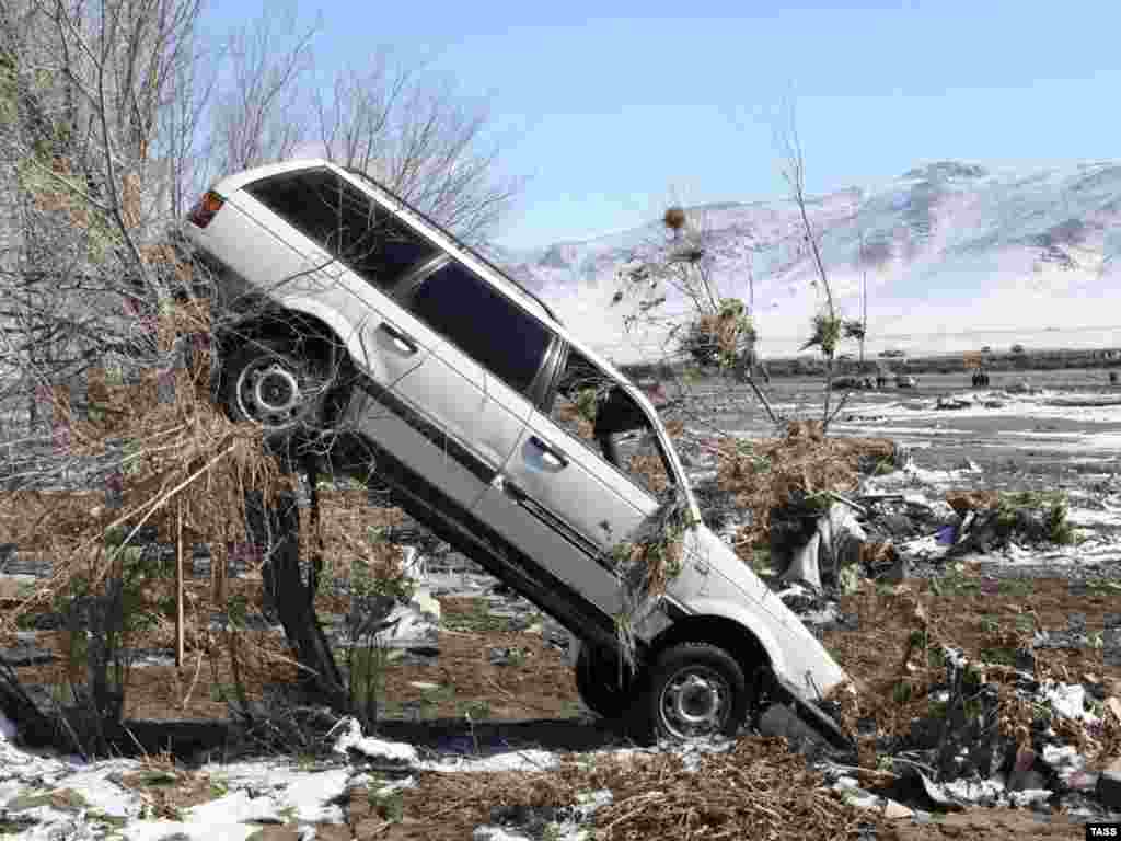 This car was swept away by floodwaters in the village of Kyzyl-Agash, Kazakhstan. - At least 35 people died and thousands were left homeless when spring flooding caused a dam to burst in the Almaty region.Photo by ITAR-TASS