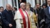 TURKEY -- Ecumenical Patriarch Bartholomew I (R) of Constantinople and Pope Francis walk on 30Nov14 at the Orthodox Patriarchal Church of St. George in Istanbul. 