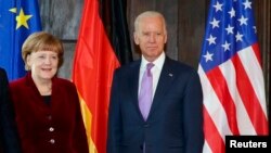 Ankela Merkel we Jo Baýden