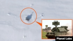A satellite image shows a position equipped with what may be a combat vehicle of a Russian Tor-M2 antiaircraft missile system (pictured in inset), about 3 kilometers from a base where evidence points to an Oreshnik missile deployment in Belarus.