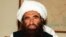 Pakistan - Founder of the Haqqani network Maulvi Jalaluddin Haqqani, gestures as he speaks with a group of media representatives in Pakistan's city of Islamabad, October 19, 2001