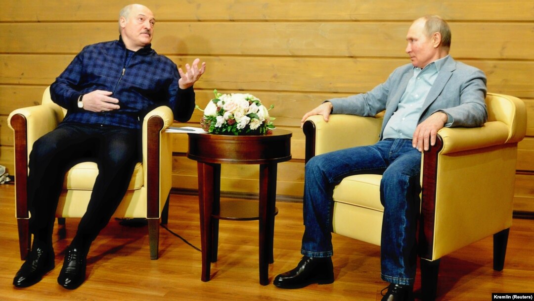 Russian President Vladimir Putin (right) and Belarus's Alyaksandr Lukashenka in Sochi on February 22. Putin may be employing Minsk's diversion of a Ryanair jet and the arrests of blogger Raman Pratesevich and his girlfriend as a litmus test of Western unity and resolve.