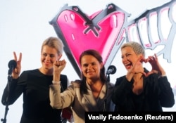 Svyatlana Tsikhanouskaya (center), Veranika Tsapkala (left), and Maryya Kalesnikava attend a campaign rally in Minsk on July 30, 2020.