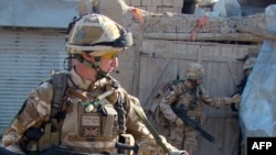British soldiers patrol in Helmand Province in December 2009.