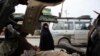 A woman looks at the site of a bomb attack in Baghdad's Sadr City on November 18.