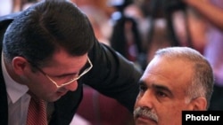 Armenia -- Armen Martirosian of the Zharangutyun Party (L) talks to its top leader, Raffi Hovannisian, during a party congress, 10Jul2010.