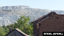 Dilapitated houses in the village of Krivalj, Serbia, overlooking part of the mining operations in Bor.