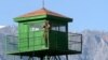 A Tajik border guard surveys the Afghan-Tajik border. (file photo)