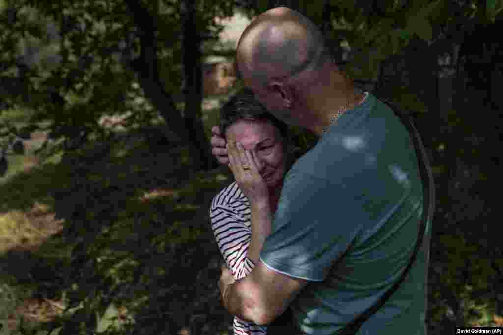 Marina Havrysh is comforted by her husband, Vadim, as she weeps while watching her elderly parents helped into a van to be evacuated to a safer part of the country in the west from their home in Kramatorsk, Donetsk region, eastern Ukraine. &quot;I understand that this will be the last time I ever see them,&quot; she said. &quot;You see their age. I can&#39;t give them the proper care.&quot;&nbsp;