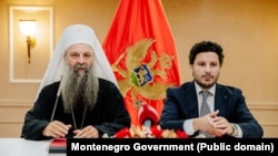 Patrijarh SPC Porfirije i premijer Crne Gore Dritan Abazović tokom potpisivanja Temeljnog ugovora. Podgorica 3. avgust, 2022. godine
