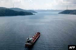 A ship with grain from a Ukrainian port sails along Turkey's Bosphorus Strait en route to Lebanon on August 3.