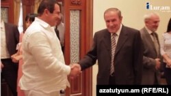 Armenia - A screenshot of ilur.am video of a meeting between former President Levon Ter-Petrosian (R) and businessman Gagik Tsarukian, 9Sep2014.