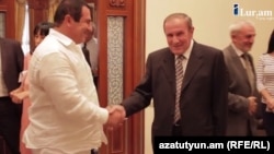 Armenia - A screenshot of ilur.am video of a meeting between former President Levon Ter-Petrosian (R) and businessman Gagik Tsarukian, 9Sep2014.