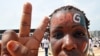 Ivory Coast -- A female supporter waits for the arrival of the leader of the Ivorian "Patriots" and national youth campaign director for presidential candidate and incumbent Ivory Coast President in Abidjan, 06Mar2010