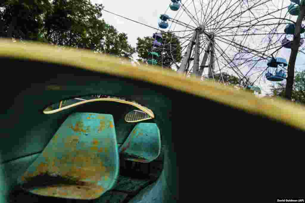 A children&#39;s ride sits empty at a shuttered amusement park in Kramatorsk on August 3.