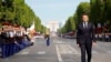 France - French President Emmanuel Macron reviews the troops during the annual Bastille Day military parade, in Paris, July 14, 2022. 