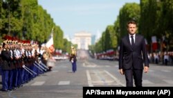 France - French President Emmanuel Macron reviews the troops during the annual Bastille Day military parade, in Paris, July 14, 2022. 