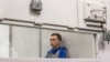 Vadim Shishimarin sits inside a cage during an appeals court hearing in Kyiv on July 25.