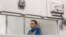 Vadim Shishimarin sits inside a cage during an appeals court hearing in Kyiv on July 25.
