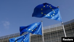 Belgium - European Union flags flutter outside the EU Commission headquarters in Brussels, June 17, 2022. 