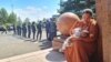 Police line up to prevent demonstrators from entering the presidential palace in Nur-Sultan on July 13. The protesters included a woman from Almaty who lost her husband in January carrying a 4-month-old baby.
