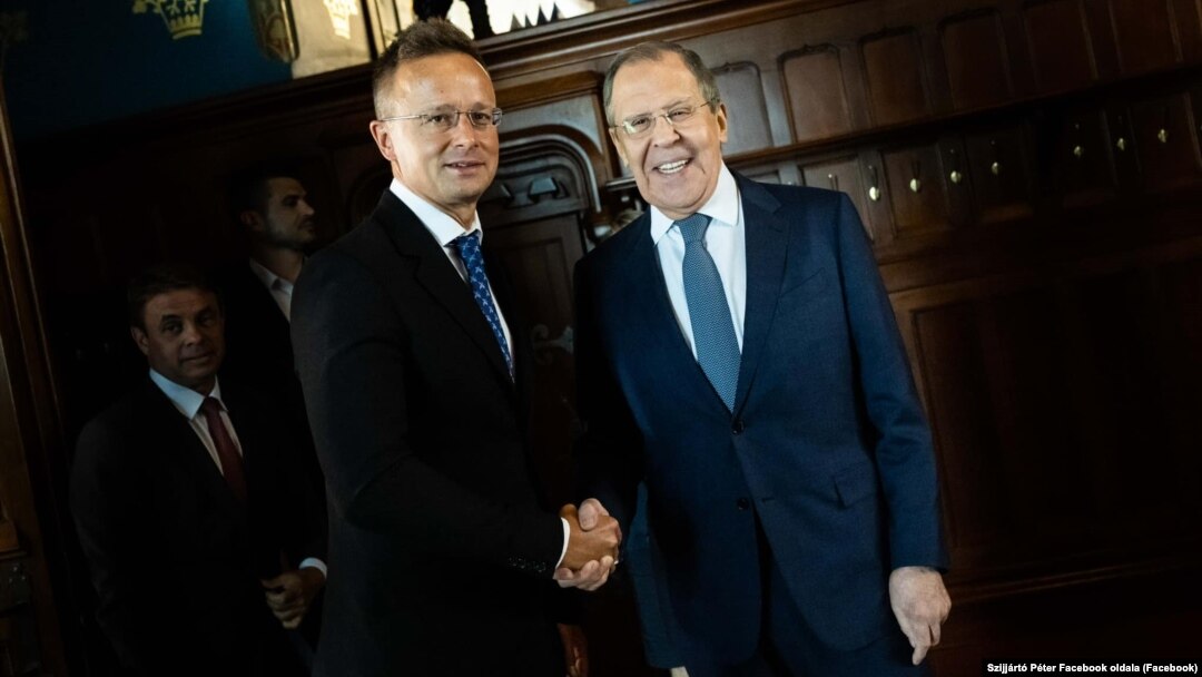 Hungarian Foreign Minister Peter Szijjarto (left) greets Russian counterpart Sergei Lavrov during a visit to Moscow in July.
