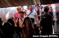 People enter a tunnel under railway platforms in Dnipro moments after the sound of explosions were heard on June 28.