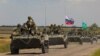 An armored convoy of Russian troops drives in the Russian-held part of Ukraine's Zaporizhzhya region on July 23.