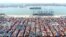 An aerial view shows containers and cargo vessels at the Qingdao port in China’s Shandong Province in May. 