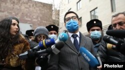 Armenia -- Armenian Justice Minister Rustam Badasian talks to journalists and opposition protesters in Yerevan, January 8, 2021.