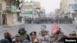 Сауд Арабиясының Қатиф қаласындағы шерушілер мен полиция қақтығысы. 11 наурыз 2011 жыл. (Көрнекі сурет).