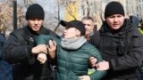 Kazakh police detain a protester in Almaty on February 22.