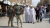 Russian soldiers stand guard in a central street in the eastern Syrian city of Deir al-Zor in September 2017.